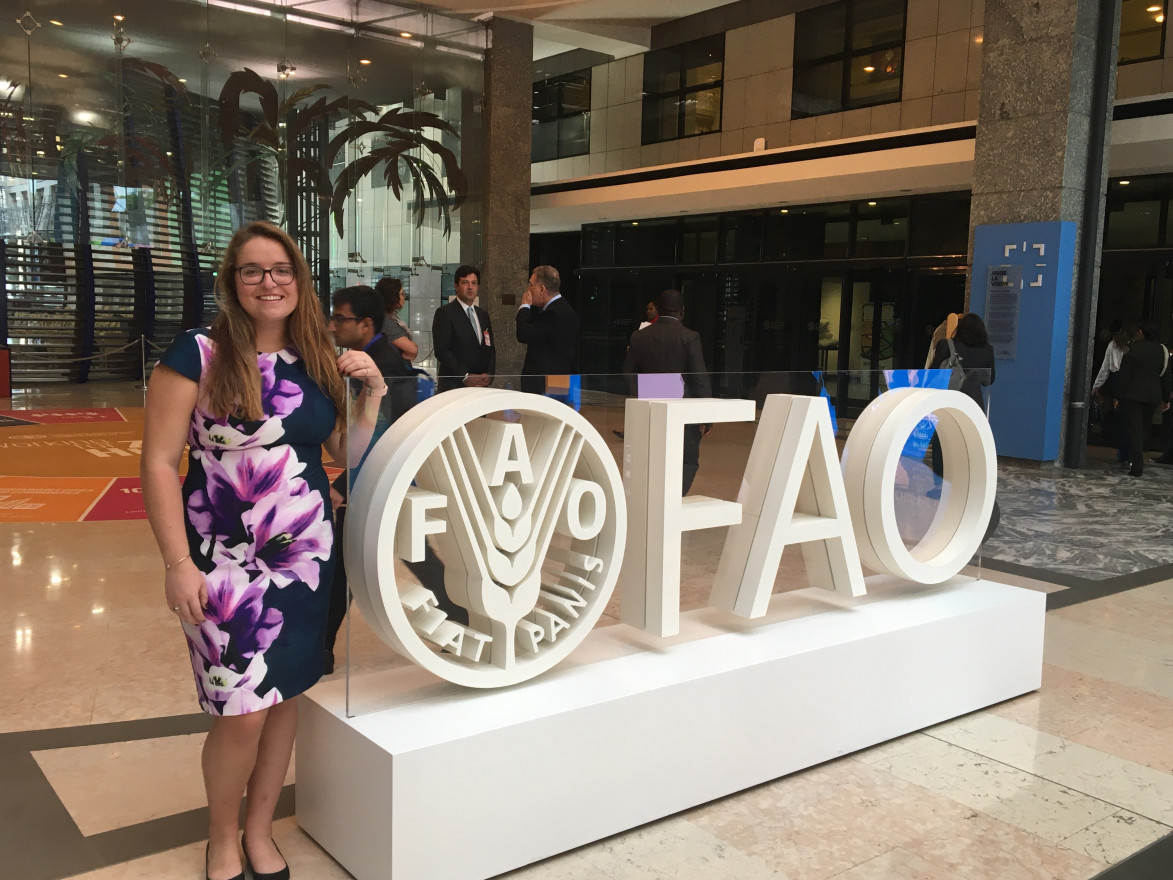 Matilda Kreider next to FAO sign