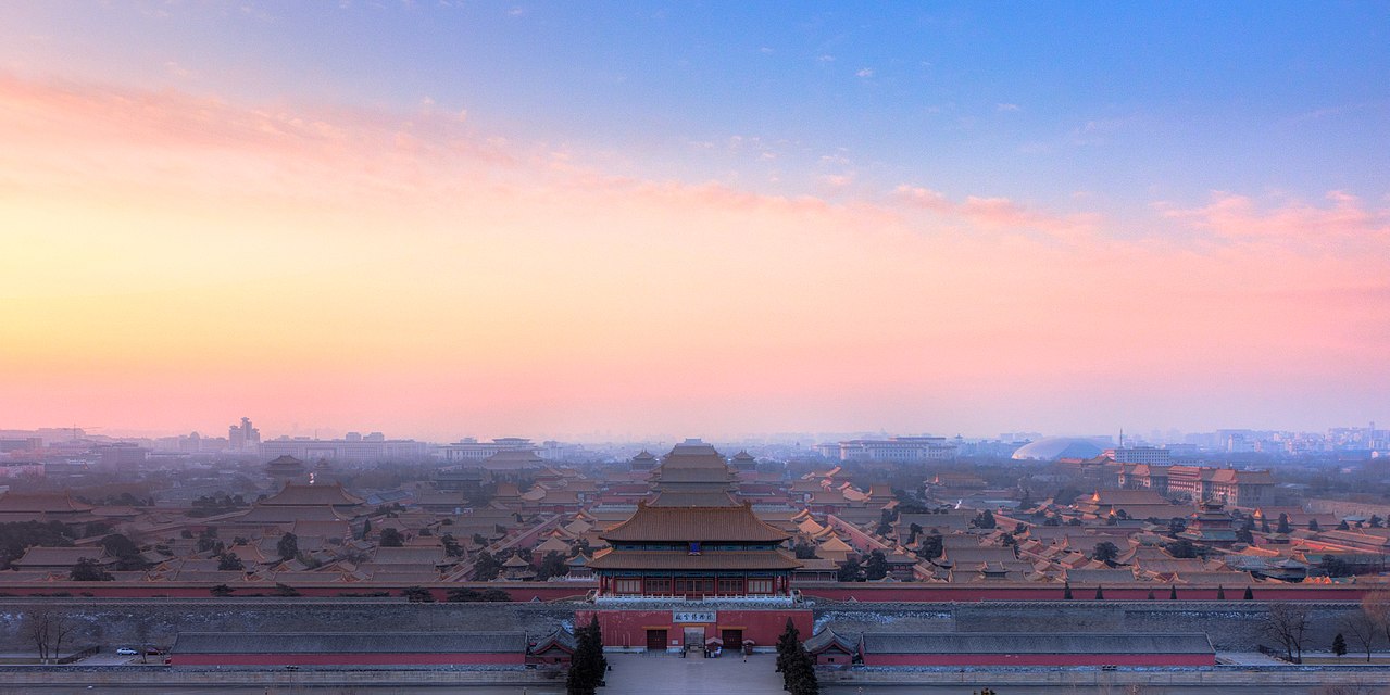 A colorful sky warms up the landscape view of the Forbidden City in Beijing, China