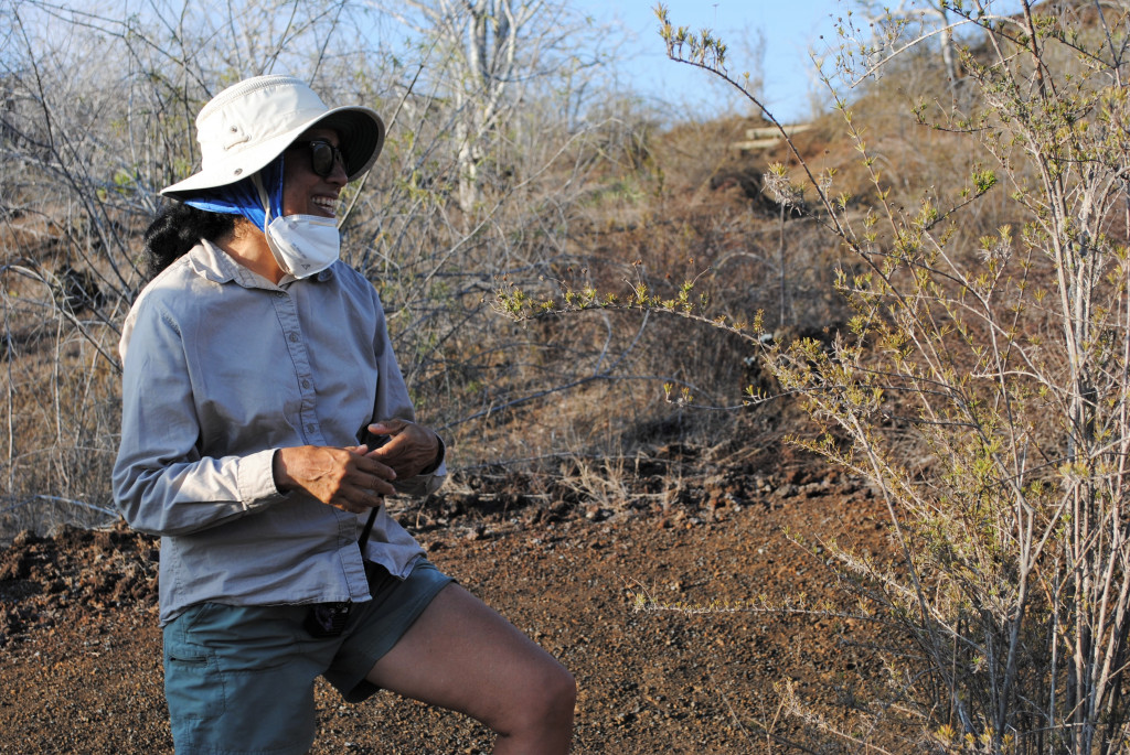 Vanessa Gallo stands next to an endemic Galapagos rosemary plant