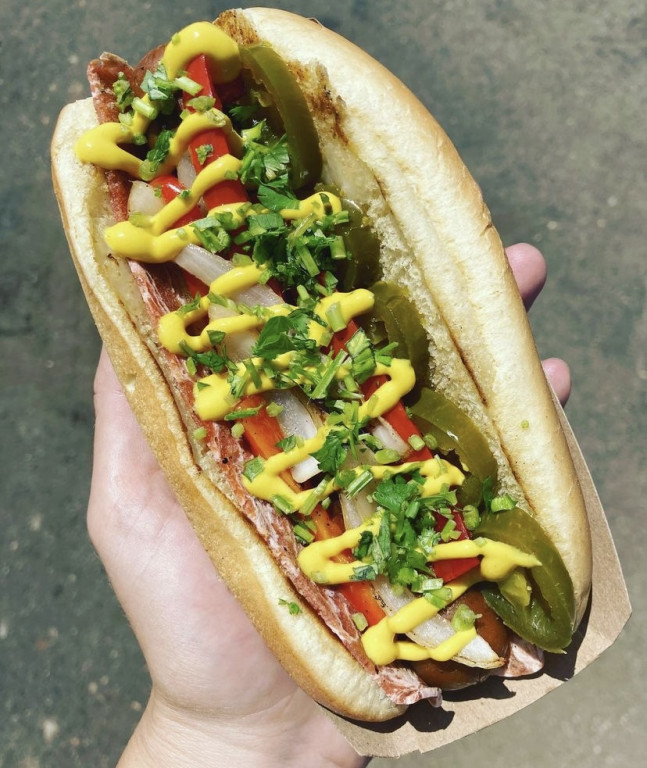 A vegan hotdog with jalapeños and other fixings. 