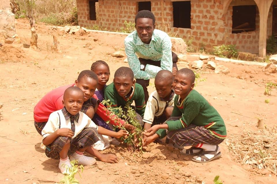 Children gather for an Igiwuló event at God’s Great Grace School in Ile-Ife, Nigeria. The campaign is also an inter-school educational program where trees are planted and climate change education is taught.