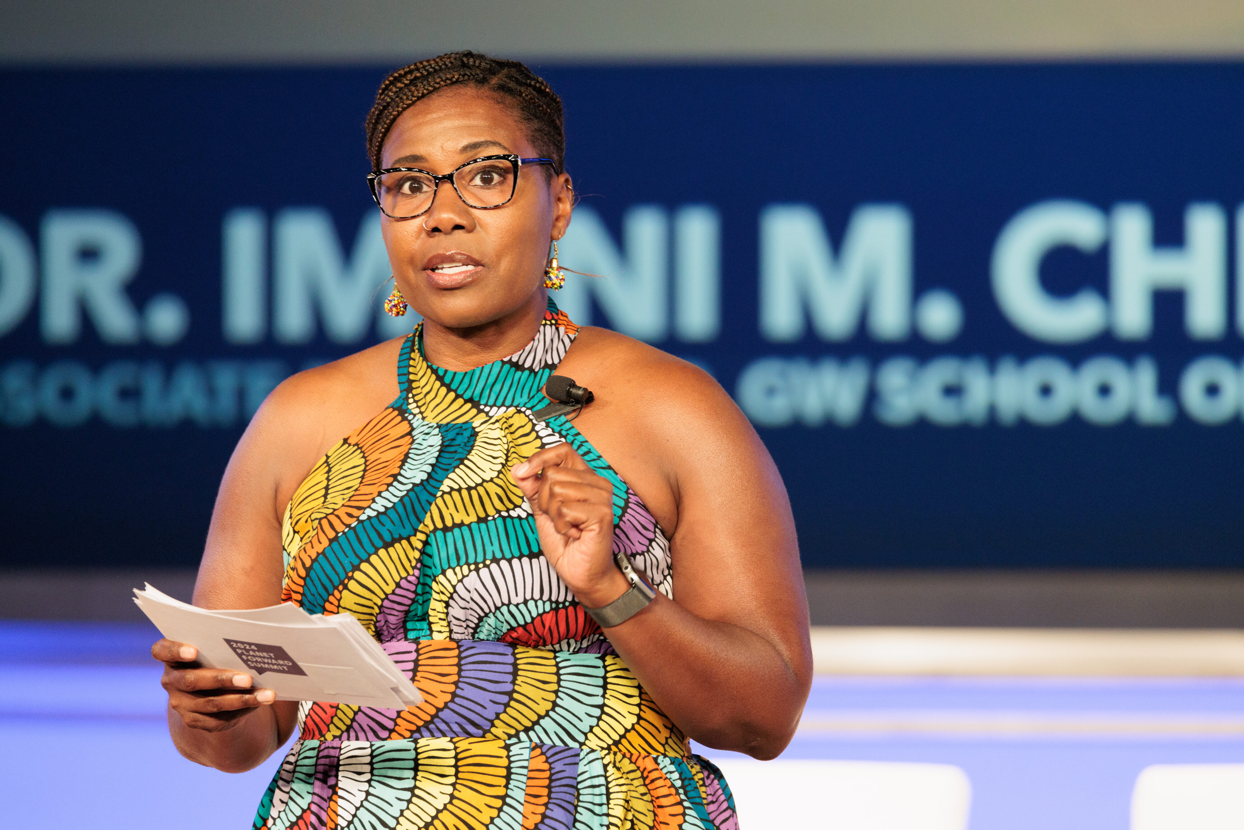 Dr. Imani M. Cheers onstage at the 2024 Planet Forward Summit. 