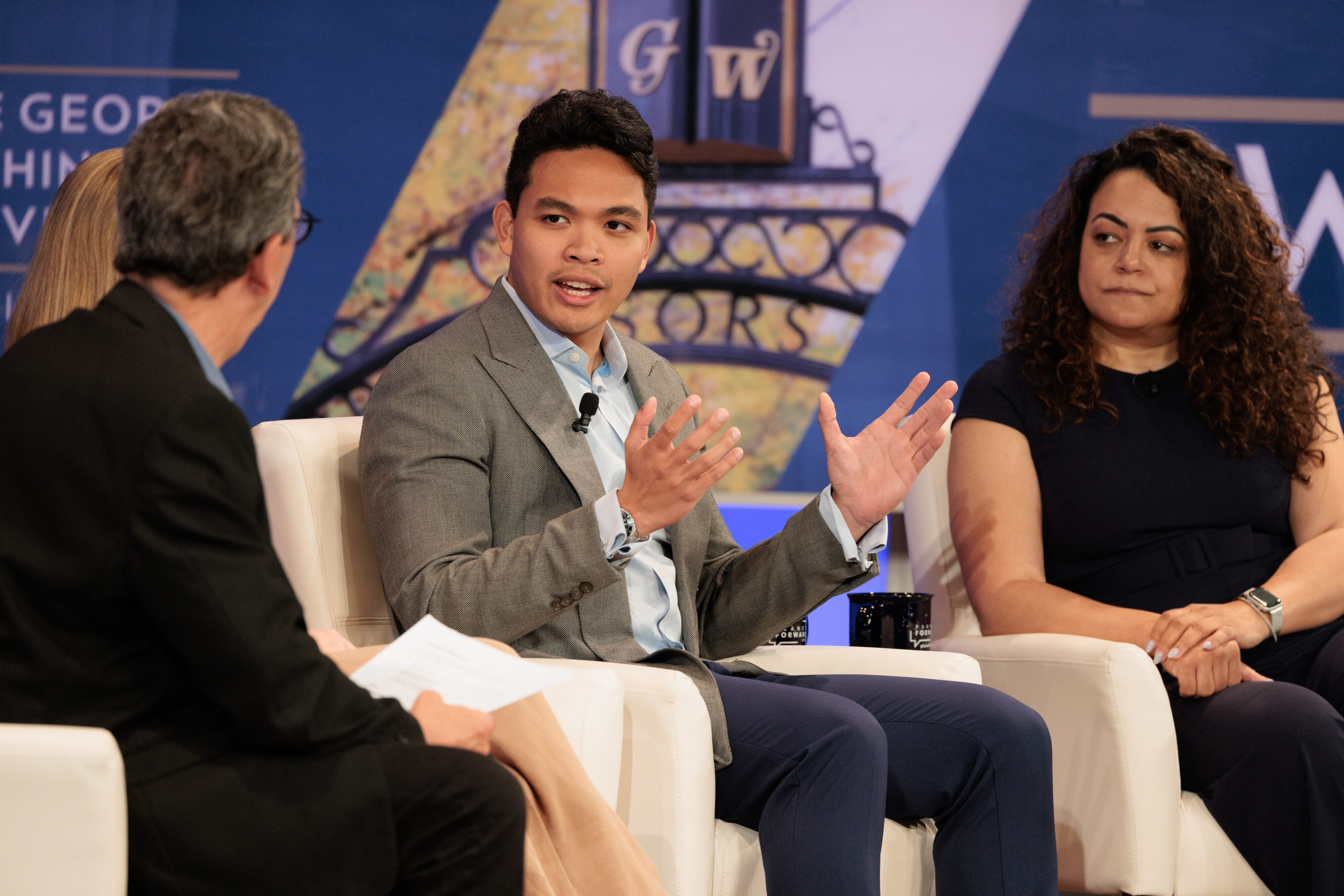 (From left to right) Joshua Panganiban, Renewables Lead Project Manager, NextEra Energy Resources; and Artealia Gilliard, Environmental Leadership & Sustainability Communications & Advocacy, Ford Motor Company; discuss corporate responsibility to sustainability. 