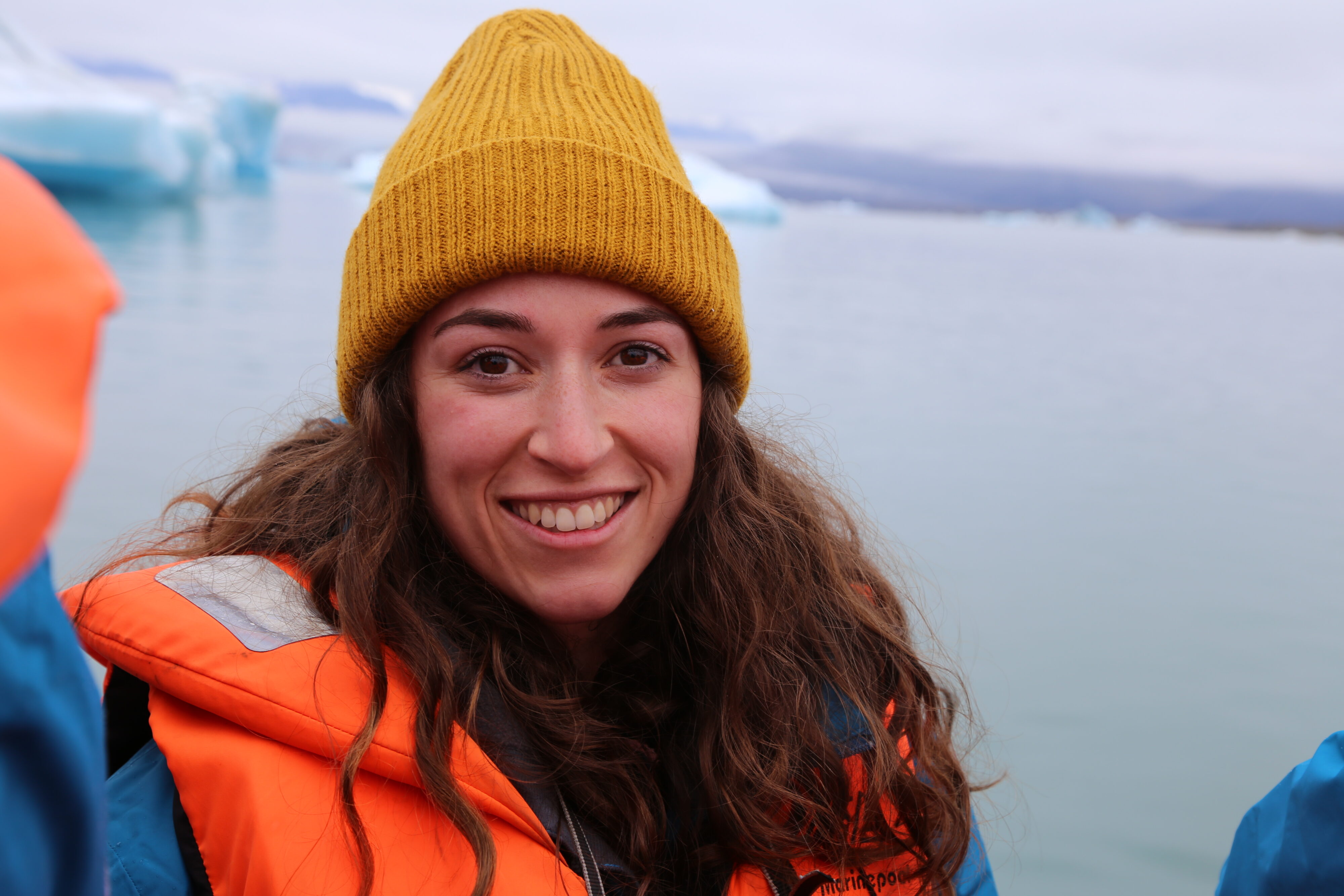 Portrait photo of Laura Isaza in front of a glacier.