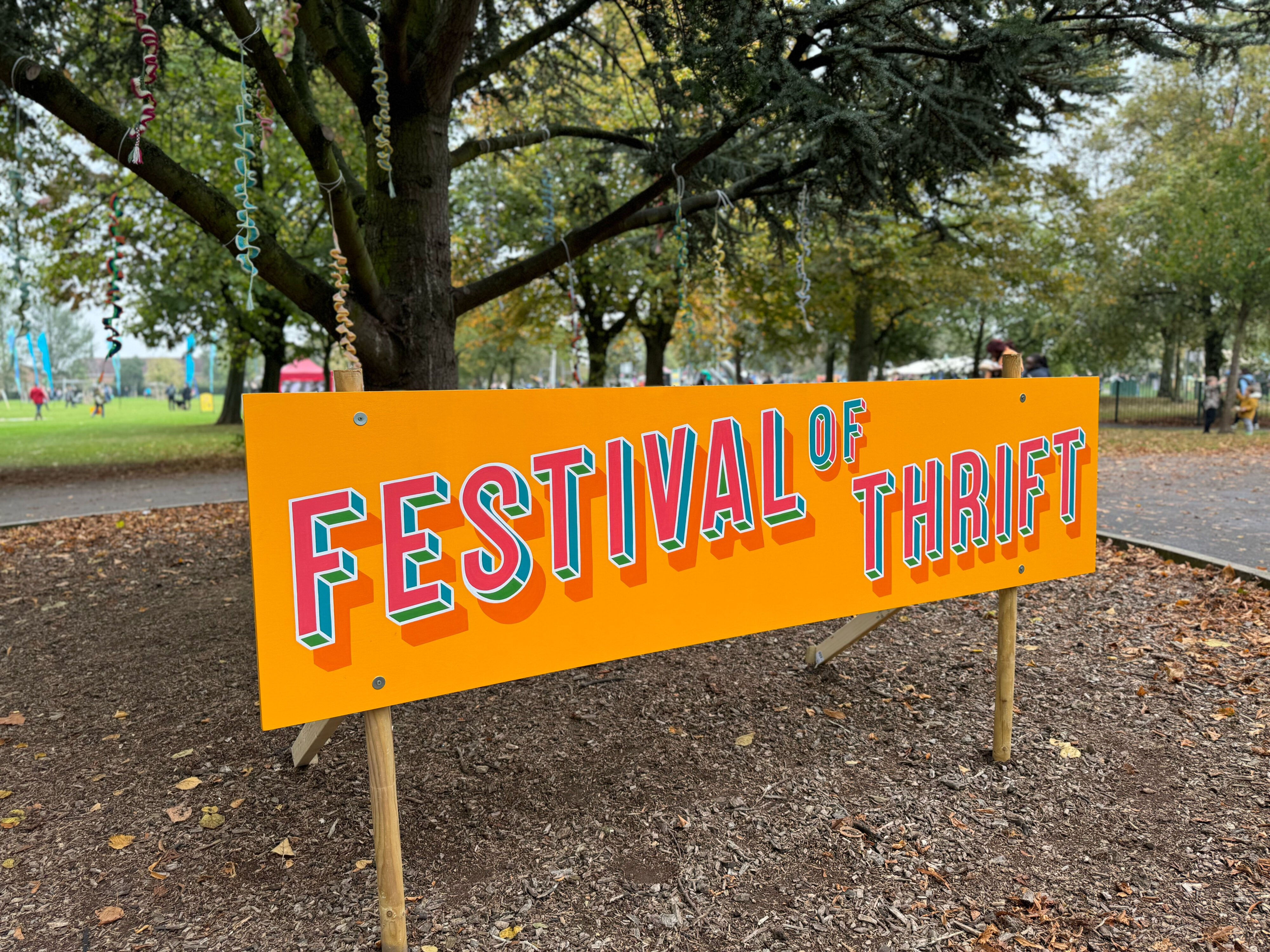 A sign reading "The festival of thrift."