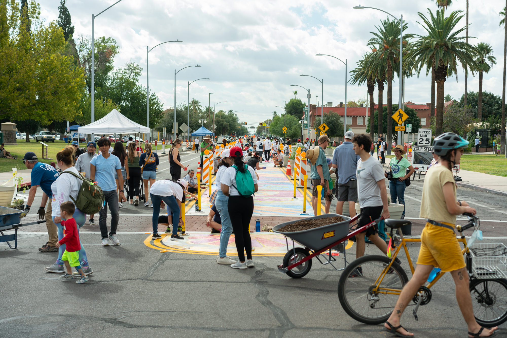 People gather in a closed street.