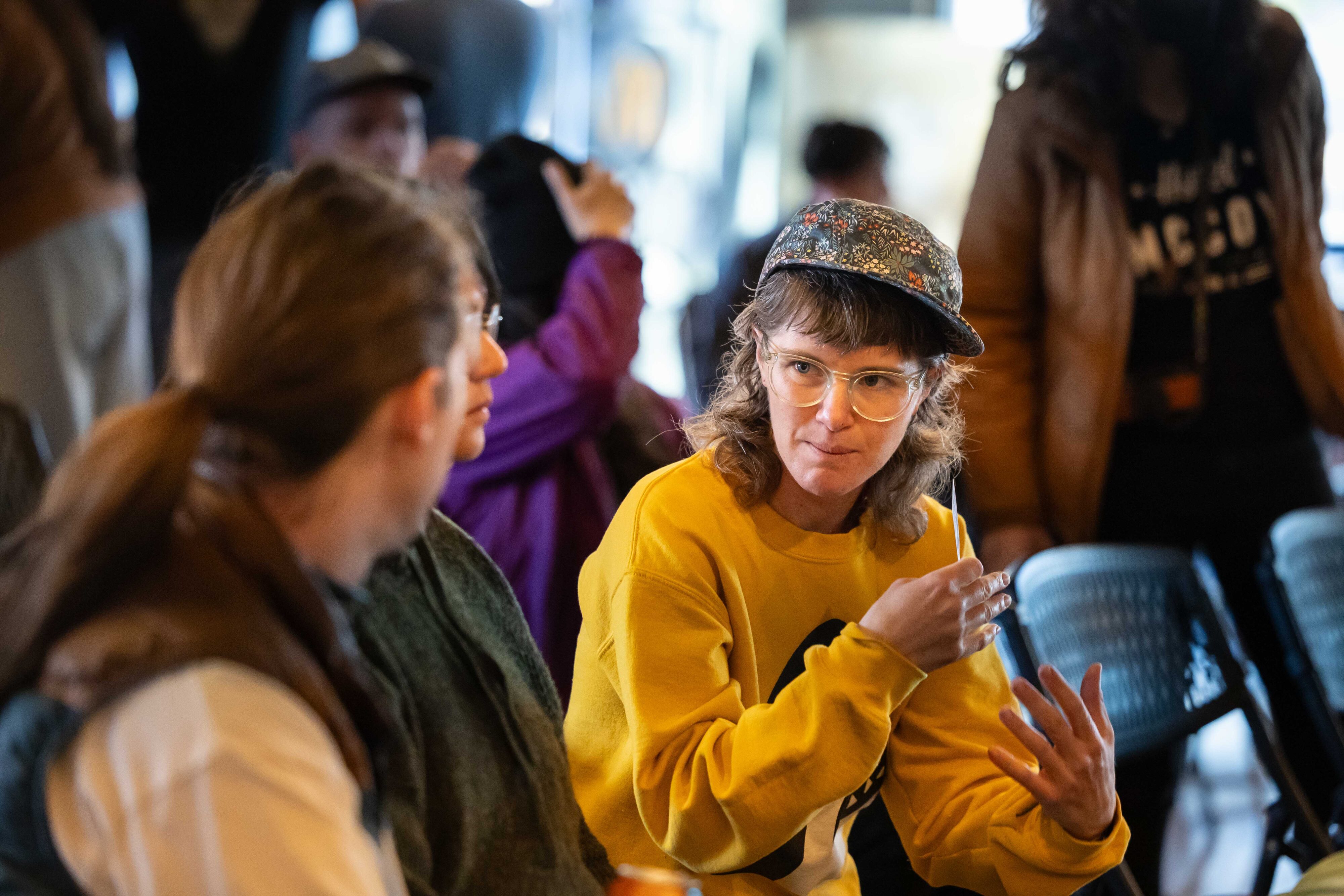 People talk at a forum.