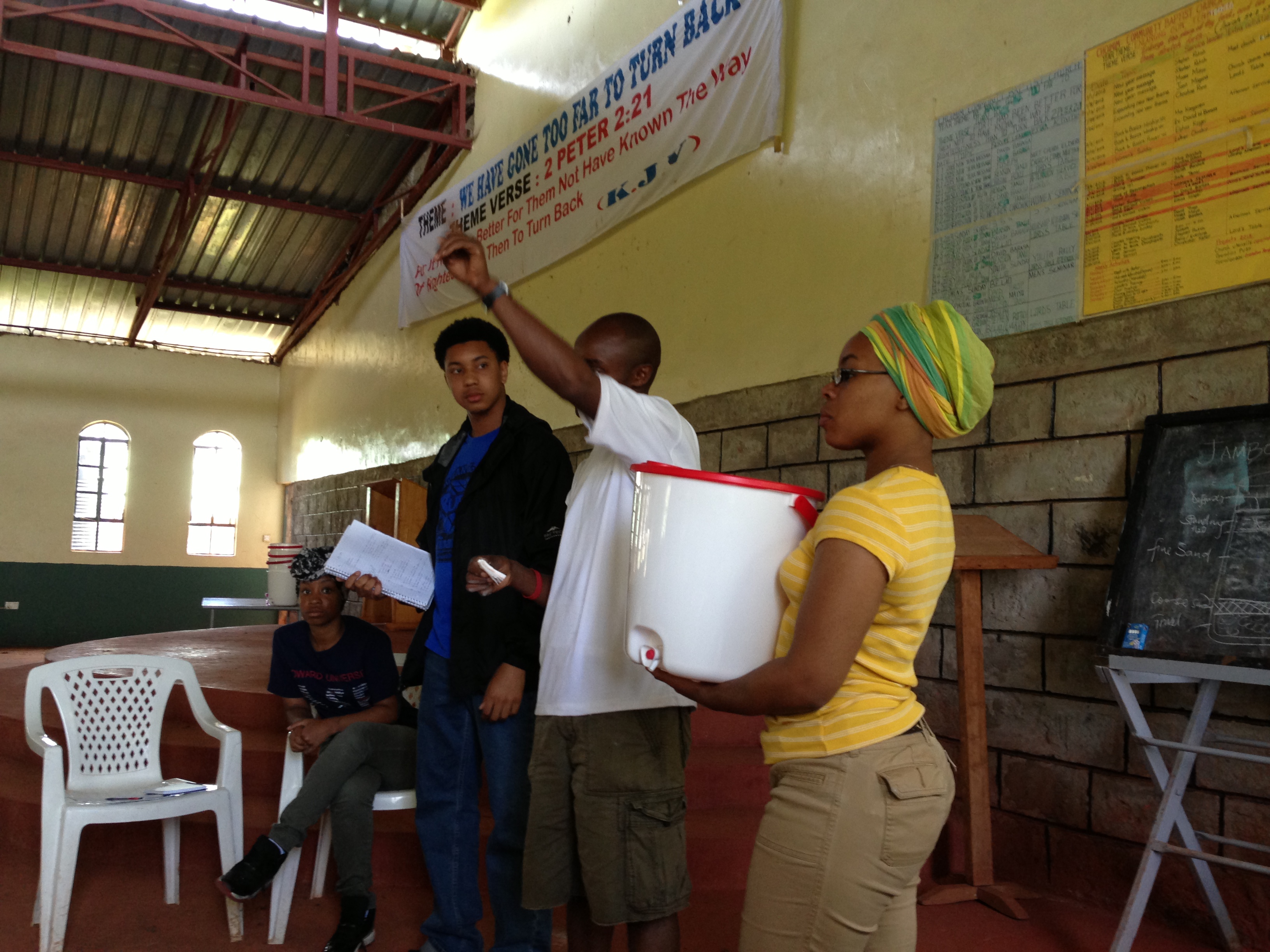 Community members lead a workshop about water filters. 