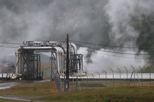 A geothermal steam field releases steam. 